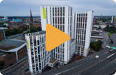 Video thumbnail of Code Coventry building with play button overlay.