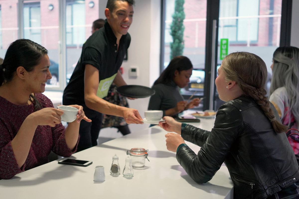 Students being served coffee at CODE Student Accommodation Leicester cafe