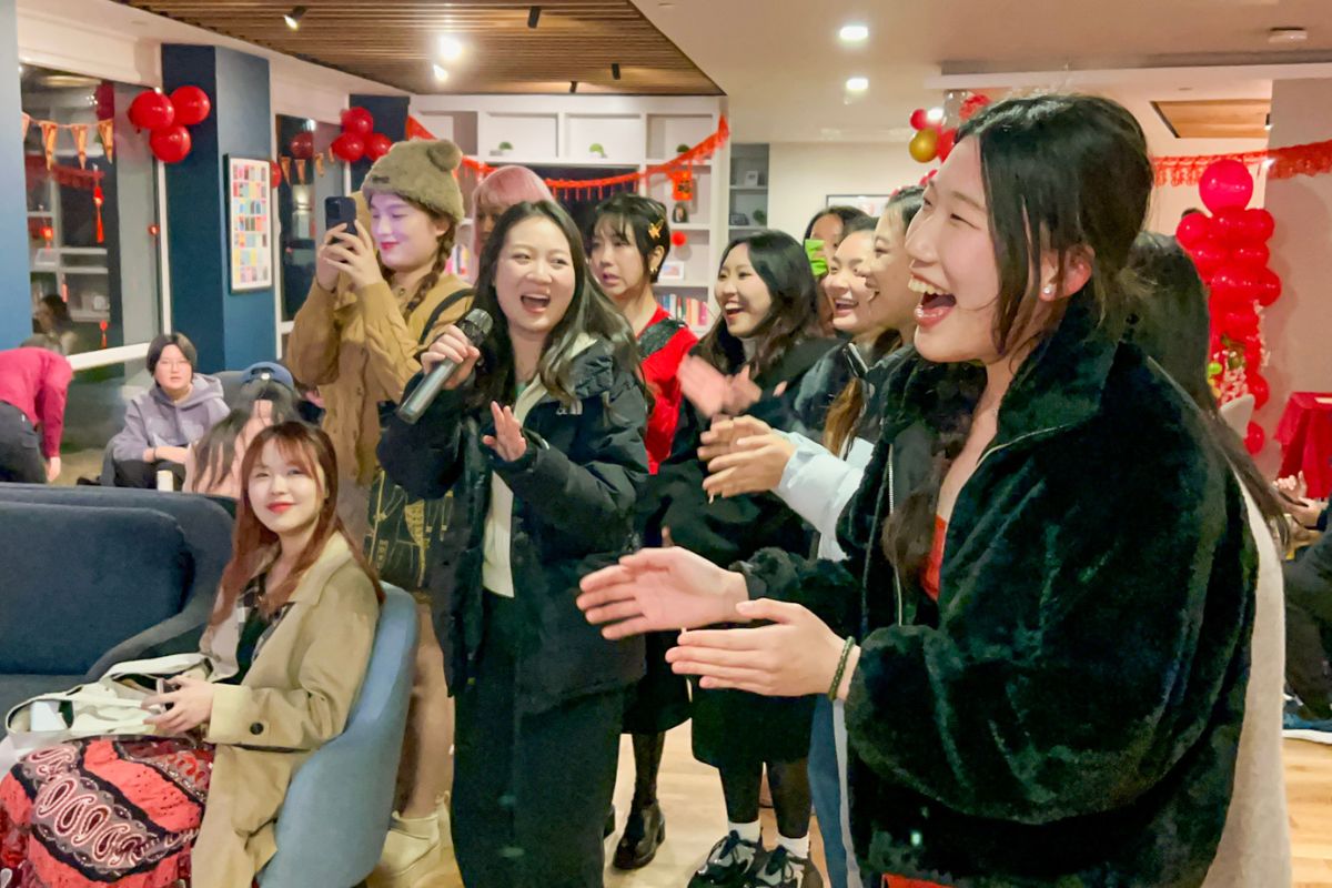 Group of girls laughing at singing in karaoke