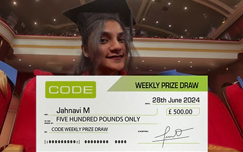 Jahnavi M holding £500 cheque