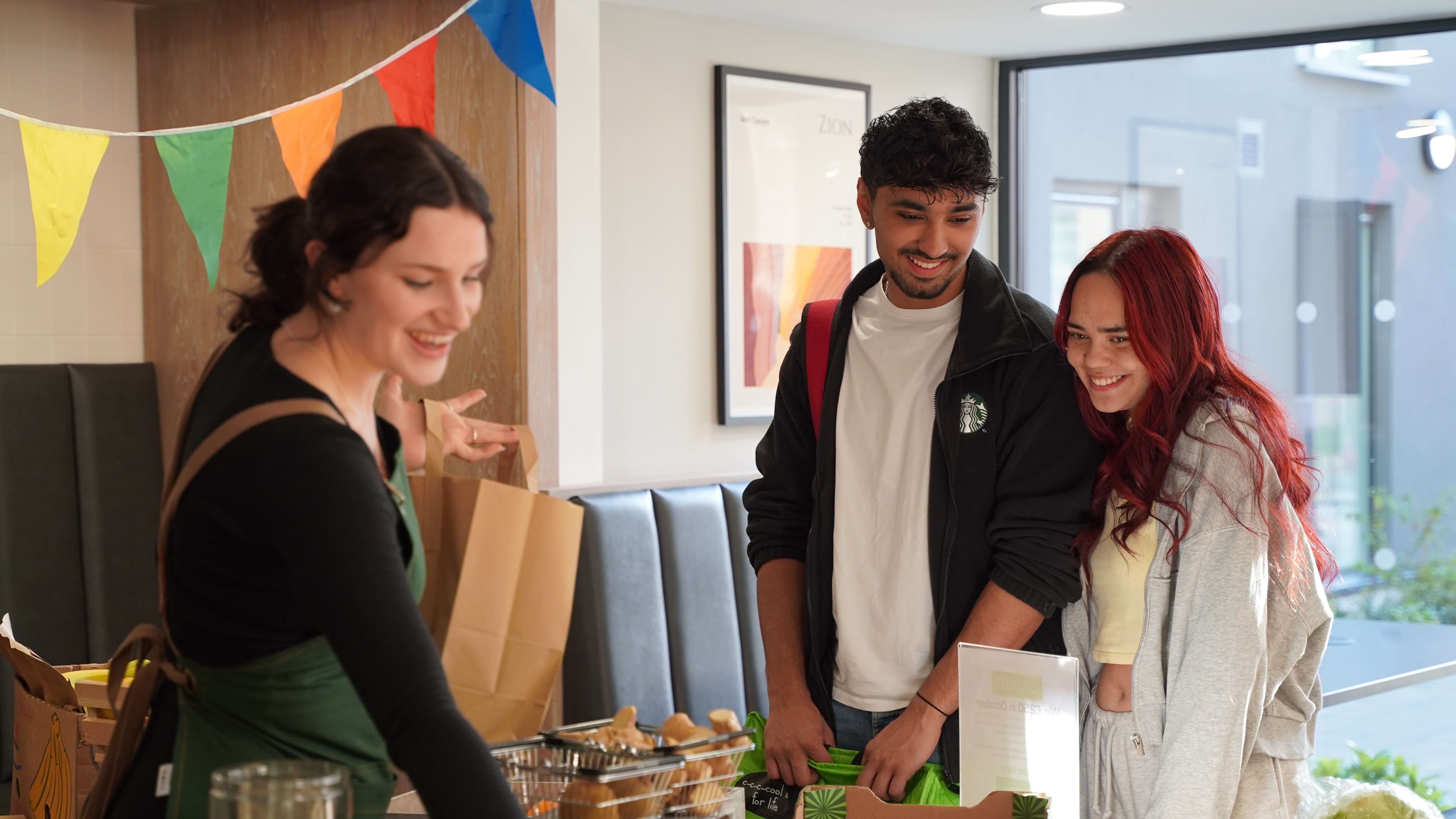 Students joining together to choose fresh fruit and vegetables