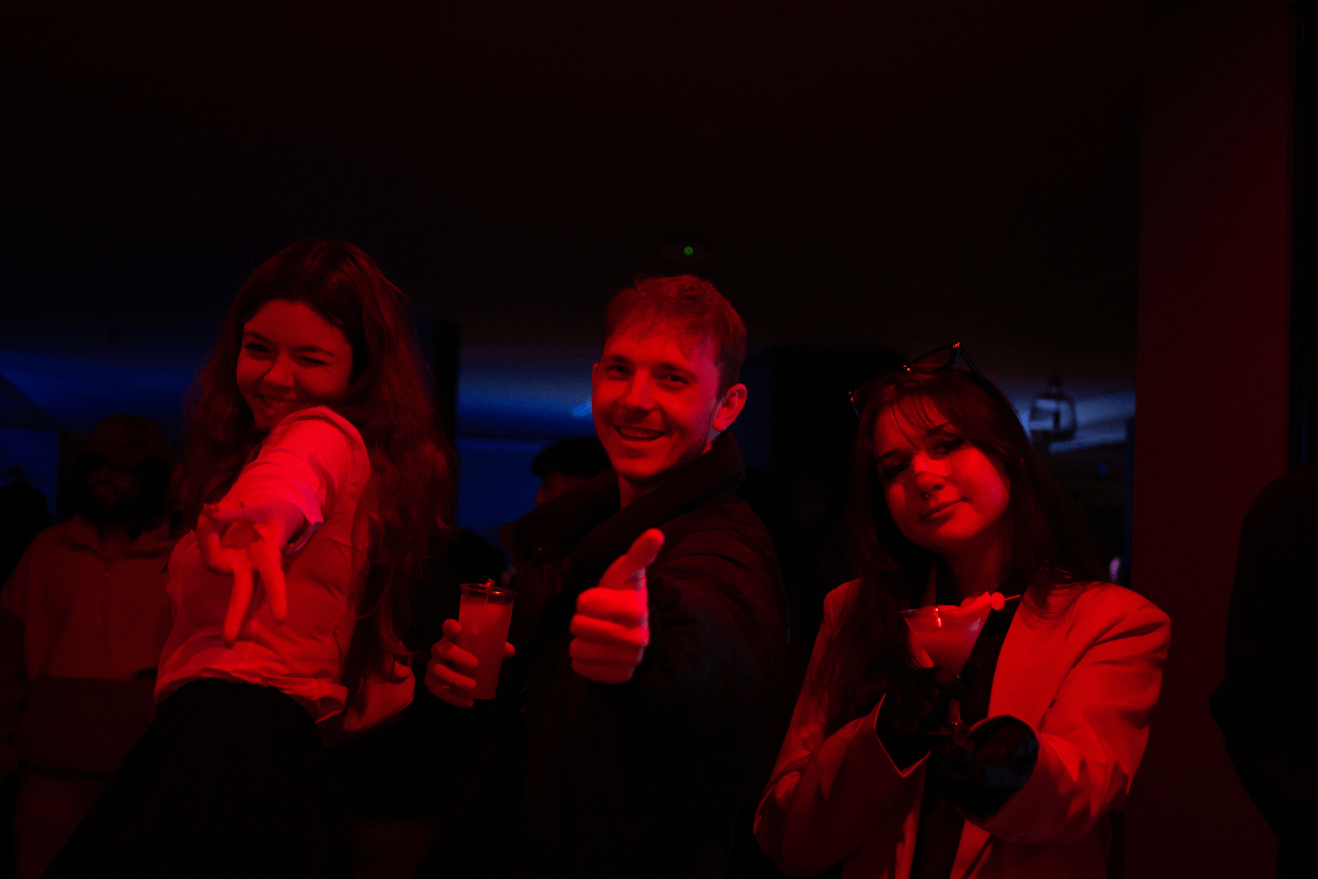 Students give a big thumbs up at the Halloween party