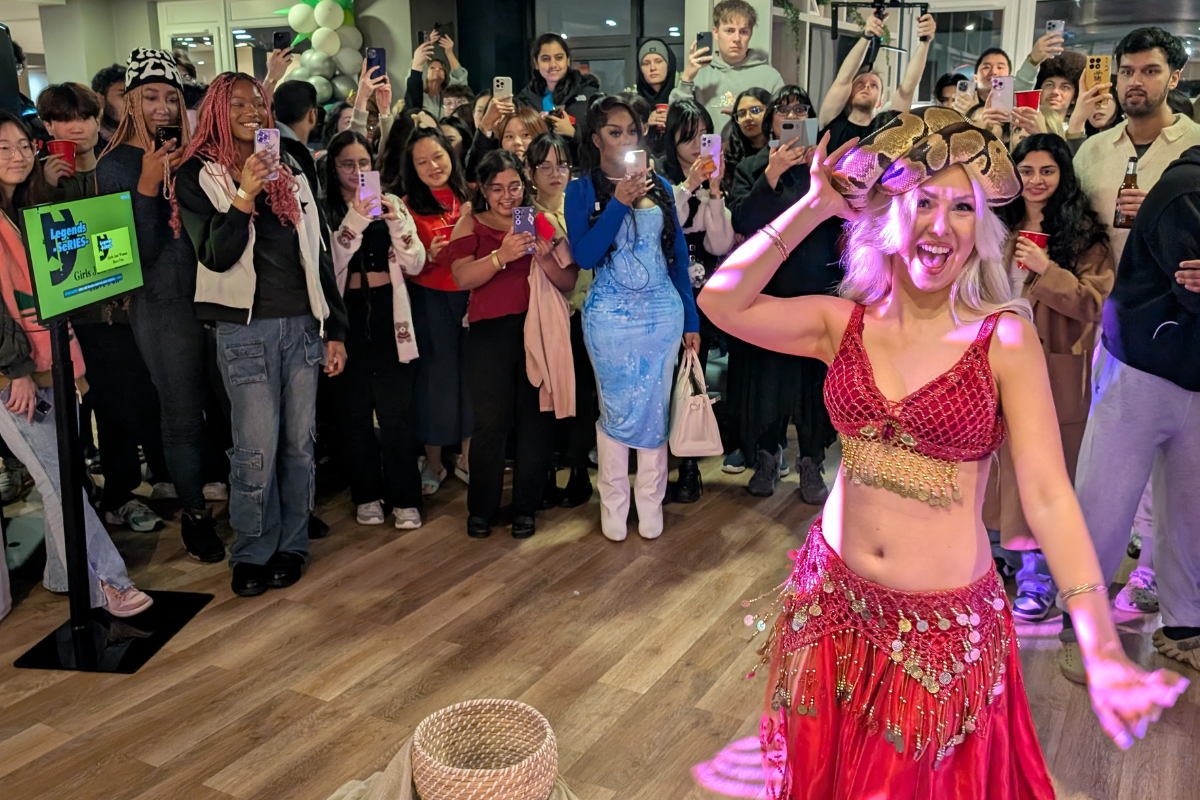 Snake charmer Lady dances in colourful costume for New Lunar Year celebration