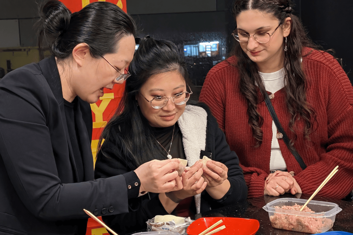 Students prepare dumplings together for the New Lunar Year Party