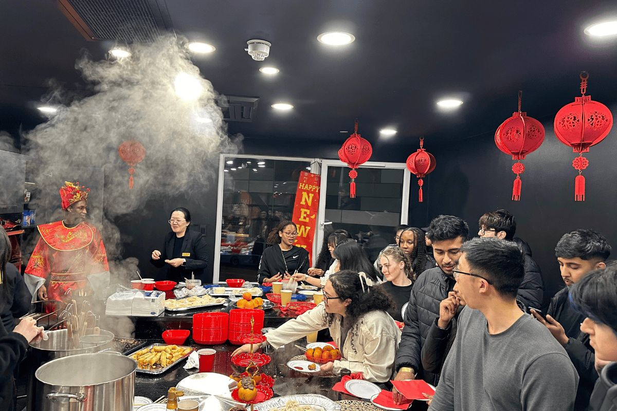 Students eagerly cook and wait for dumplings