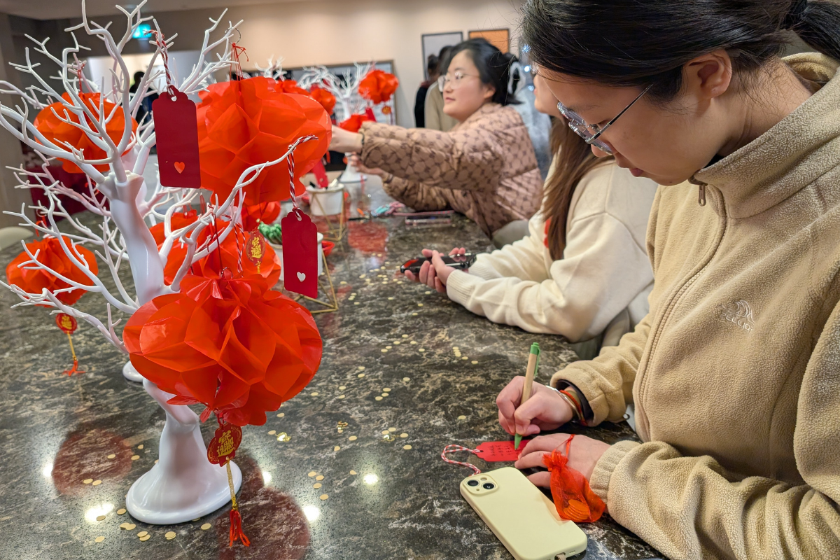 Woman crafts a message for the Lunar Year