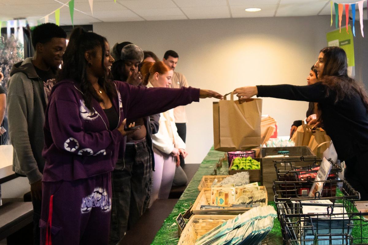 Students grabbing a bag full of freebies at our pamper day event