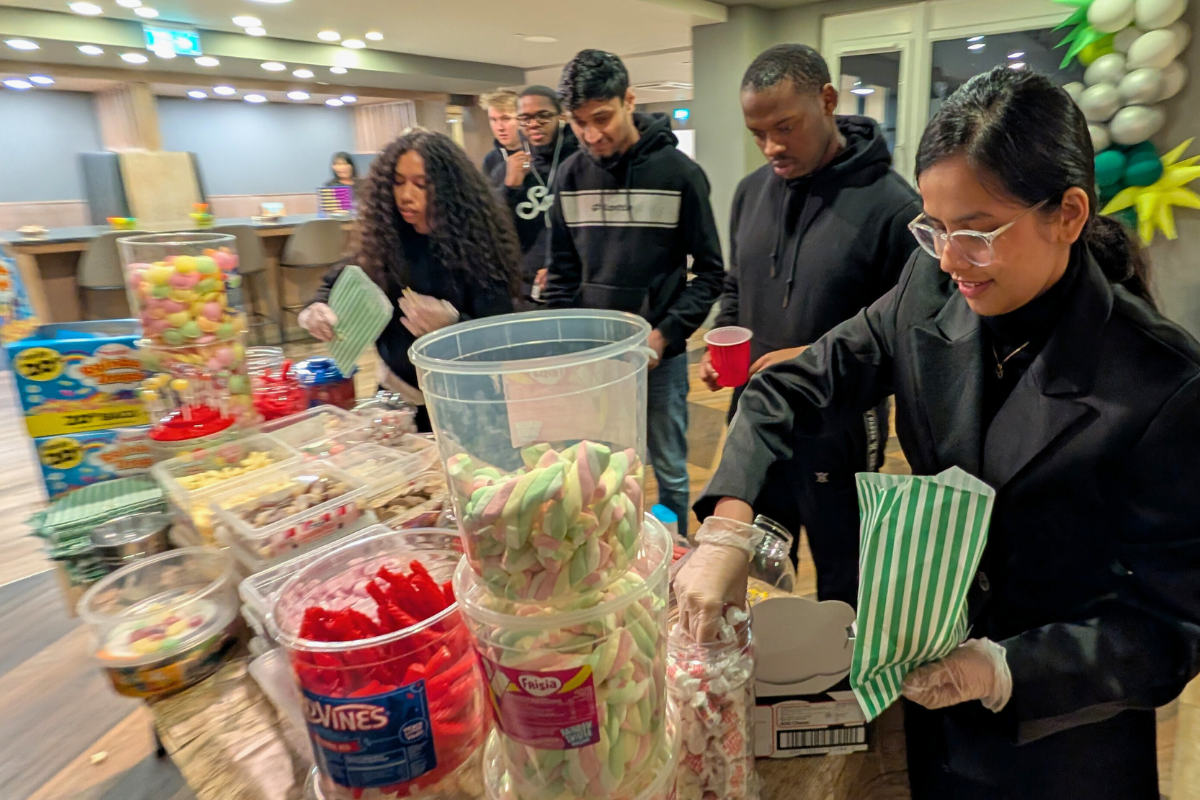 CODE tenants waiting in line to get some sweets at the sweets, drinks and games event in February 2025