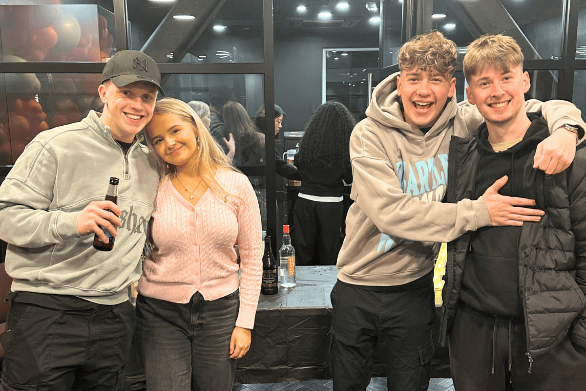 A group photo of 3 boys and a girl at the CODE sweets, drinks and games event