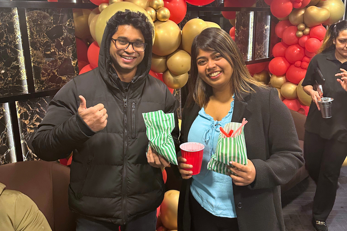 Two tenants with their sweet bags posing for the camera