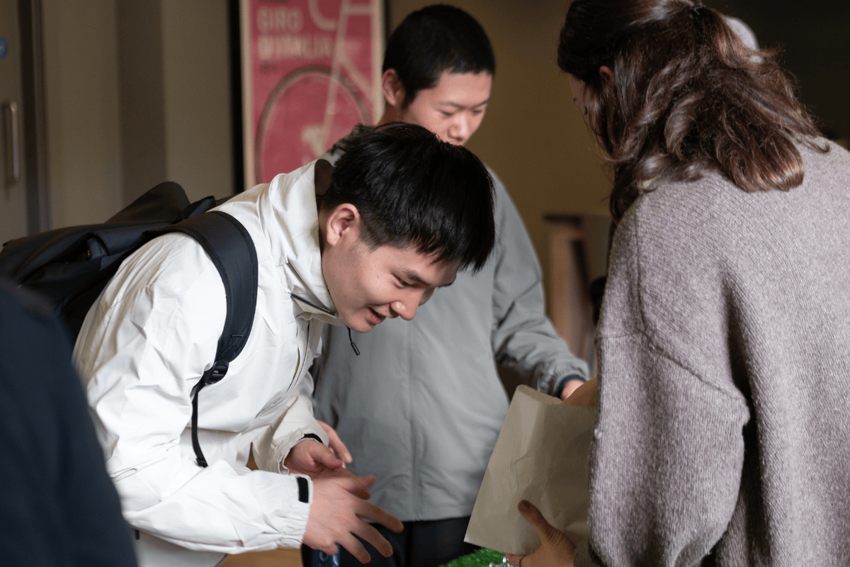 Student smiles whilst browsing pamper products