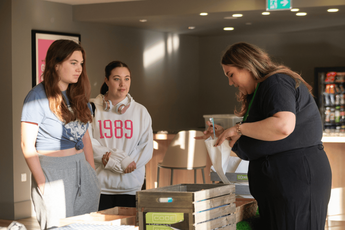 Staff packs a pamper goodie bag for two students