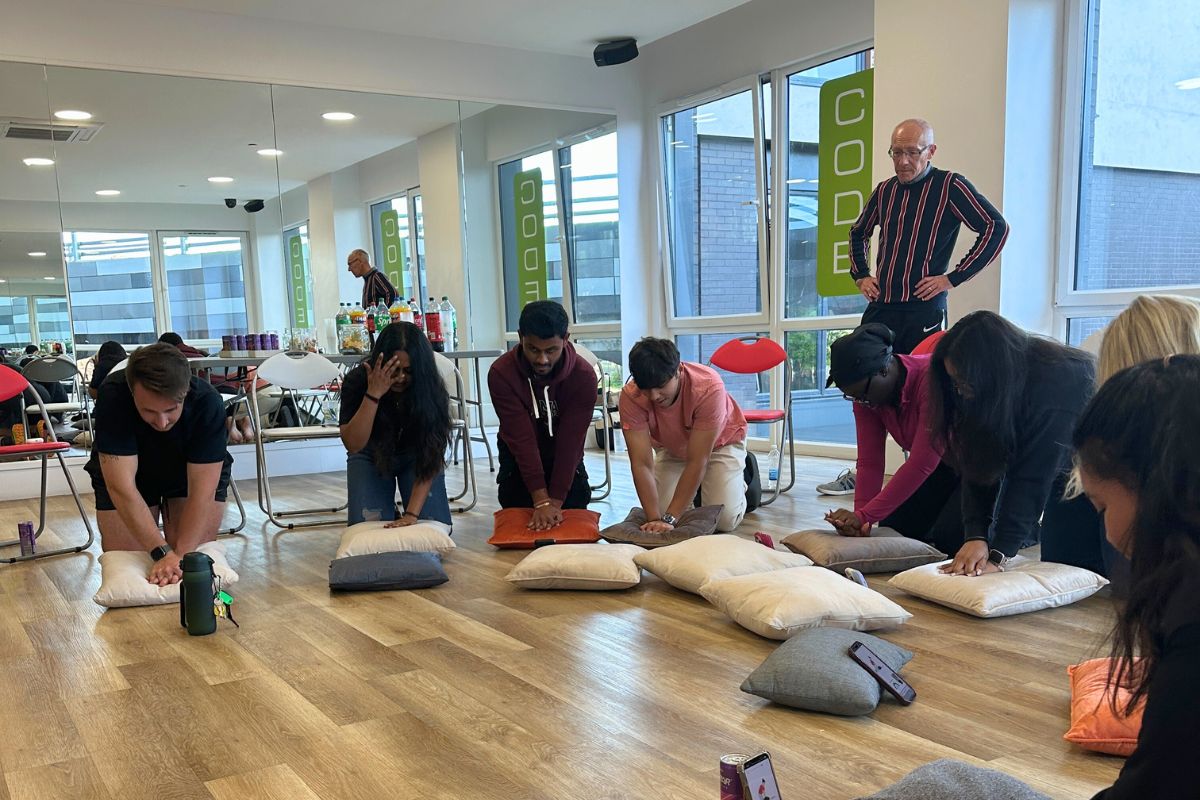 A group of students practicing their CPR skills