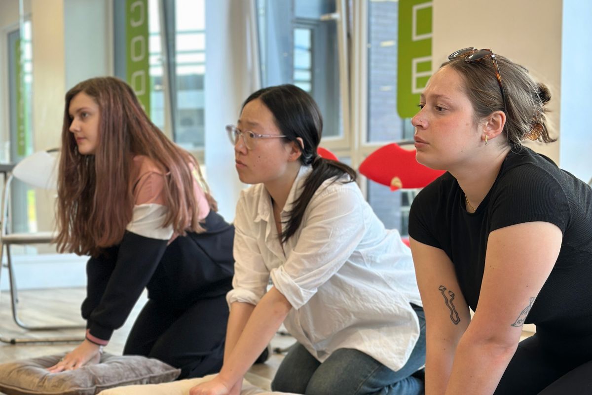 Three students focusing during the CPR training at CODE Fairfax