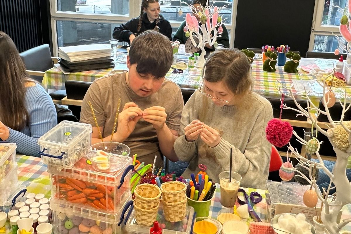 Two friends making easter crafts at our event at CODE