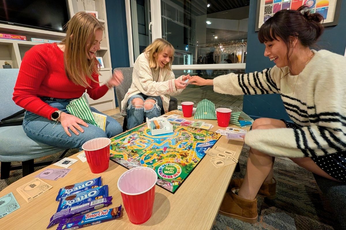 Three CODE tenants playing a game together at our games night event in Coventry