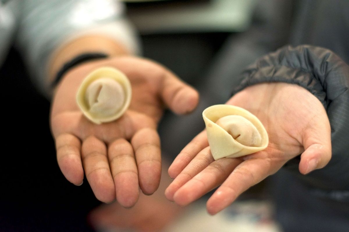 Tenants showing off their dumplings at Chinese New Year