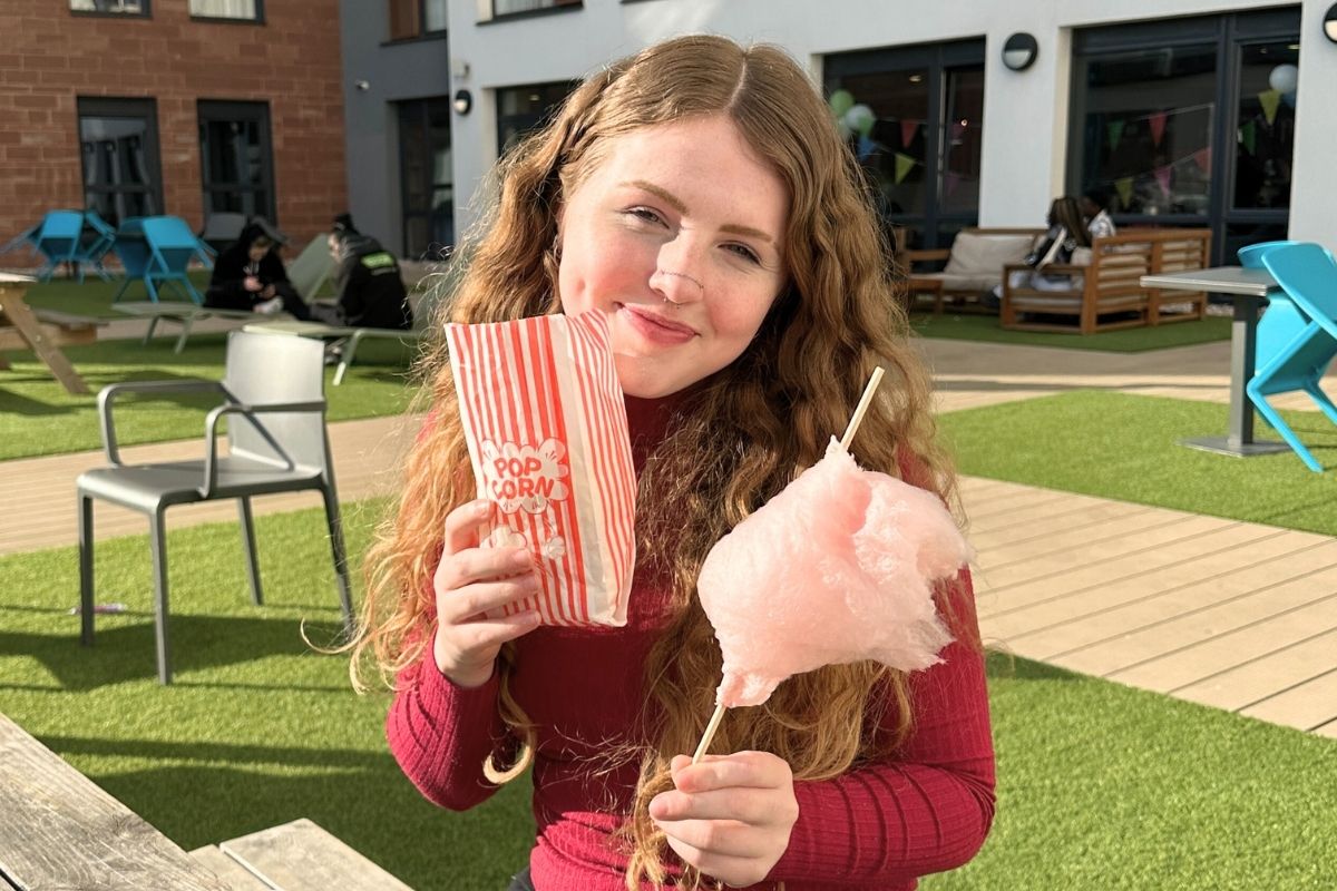 A CODE tenant enjoying her snacks on the terrass