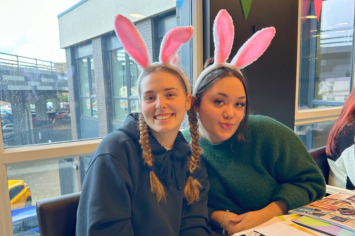 Two CODE tenants at the easter crafting event wearing bunny ears