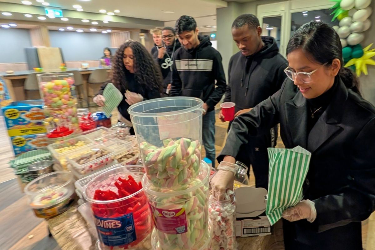 CODE tenants waiting in line to get some sweets at the sweets, drinks and games event in February 2025
