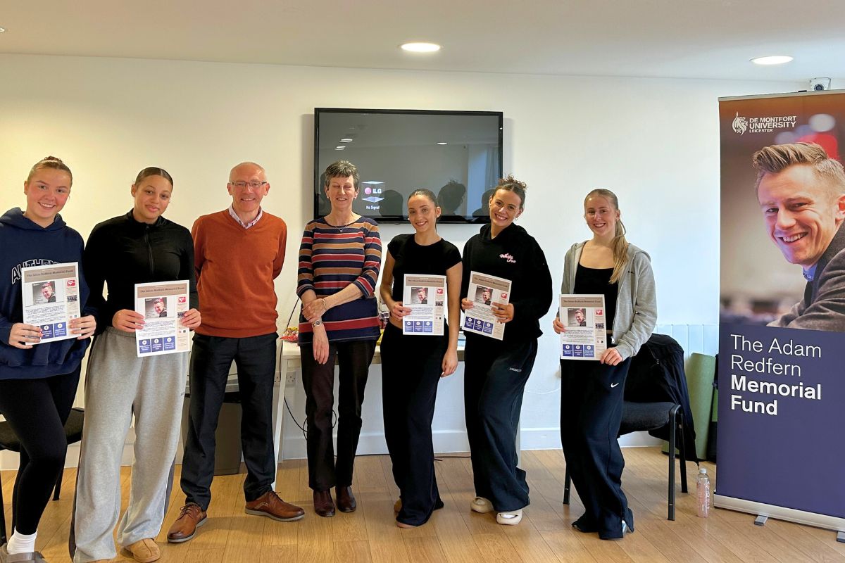 A grout of students holding up their CPR certificates after completing the training in collaboration with the Adam Redfern Memorial Fund