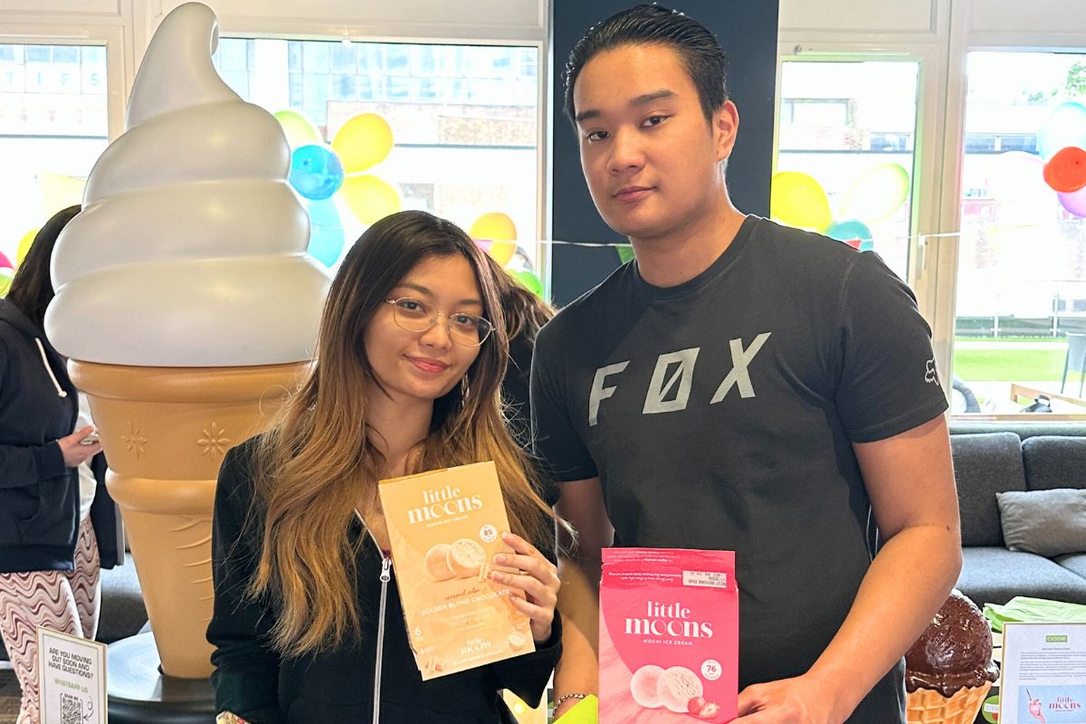 Two CODE tenants posing with little moons at the code event in June