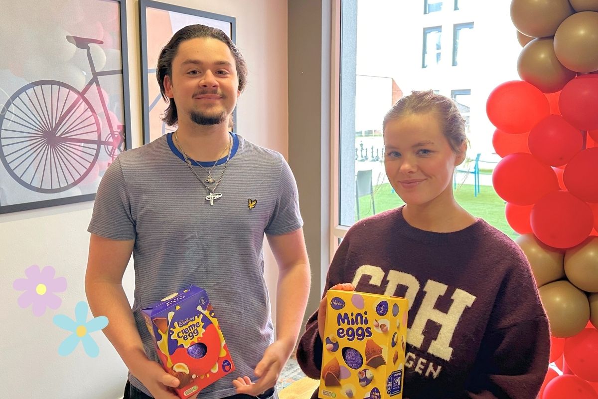Two CODE tenants holding their chocolate eggs