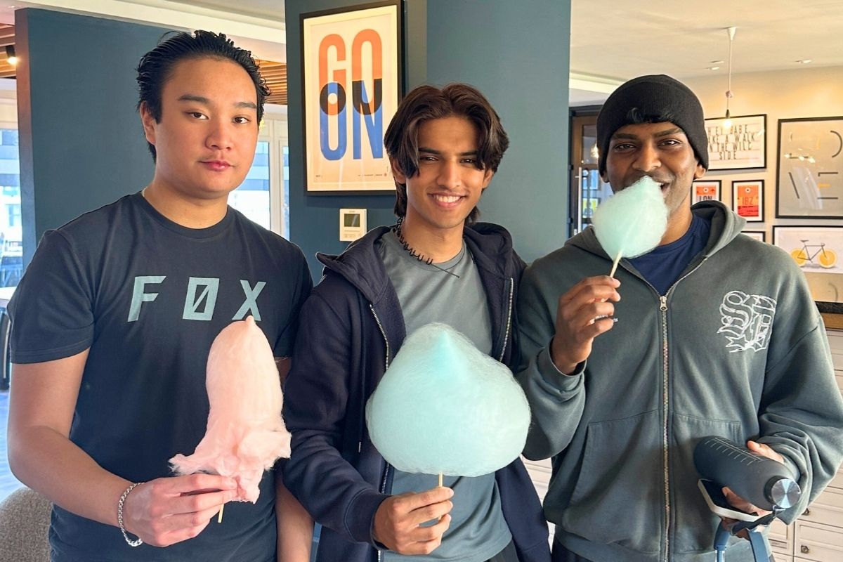 Three friends enjoying candy floss and the CODE event