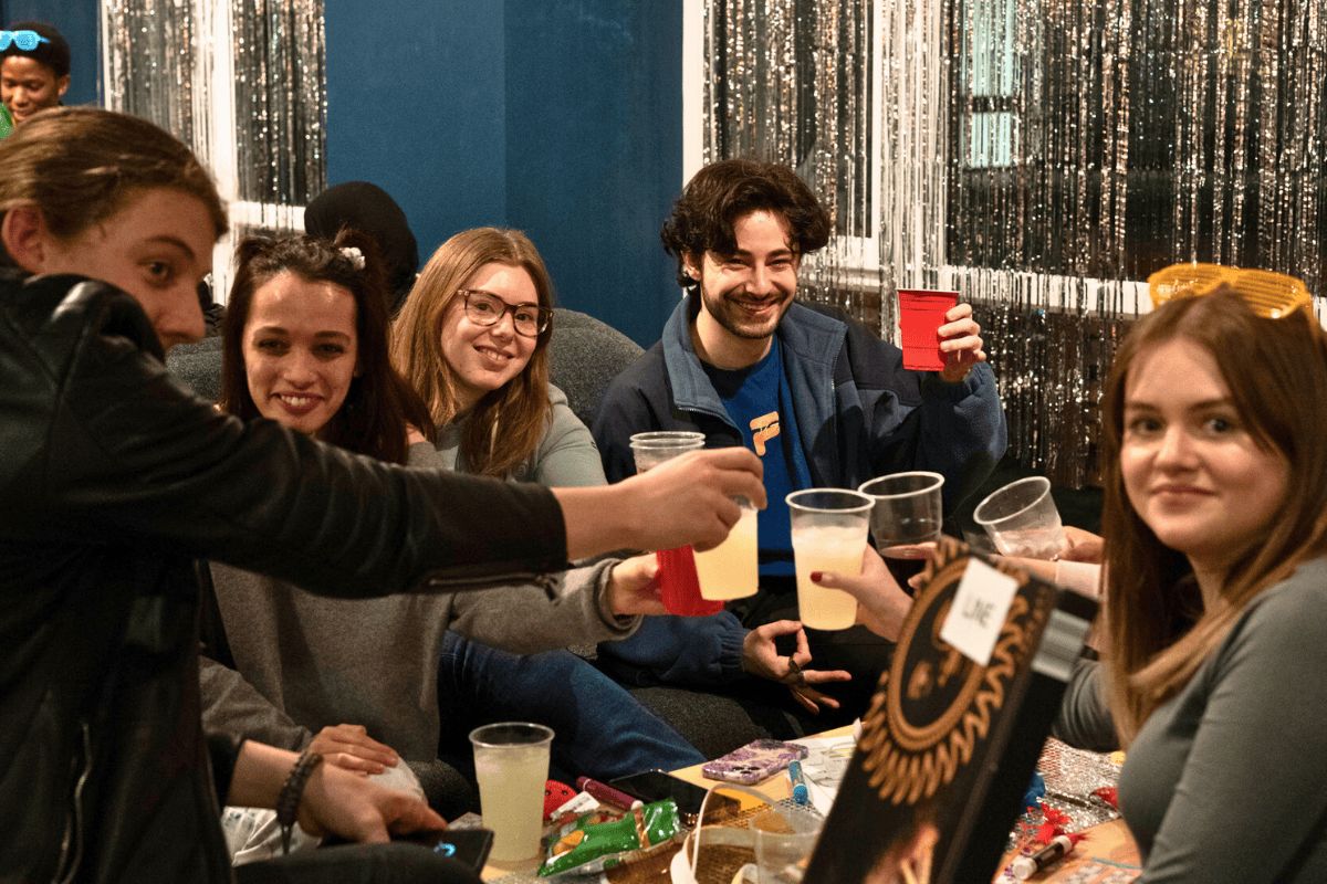 Students playing bingo and doing cheers at the bingo event