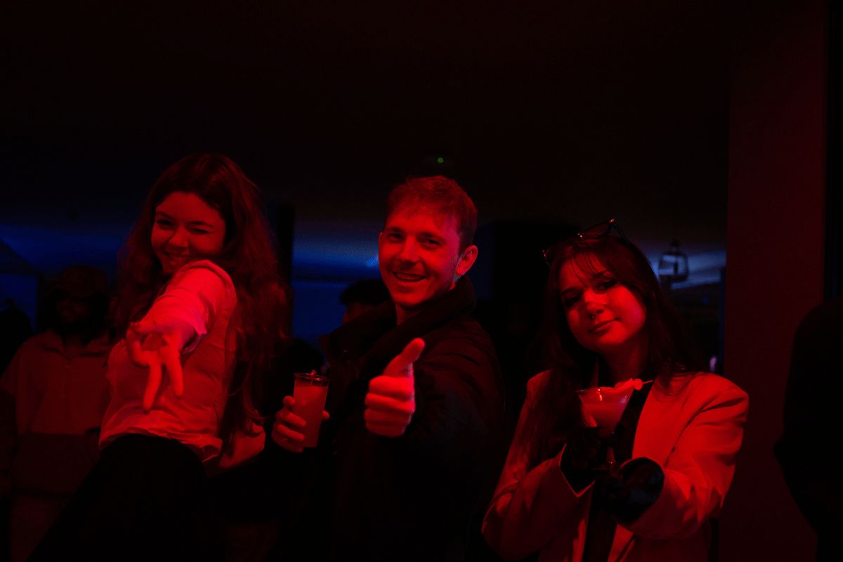 Students give a big thumbs up at the Halloween party