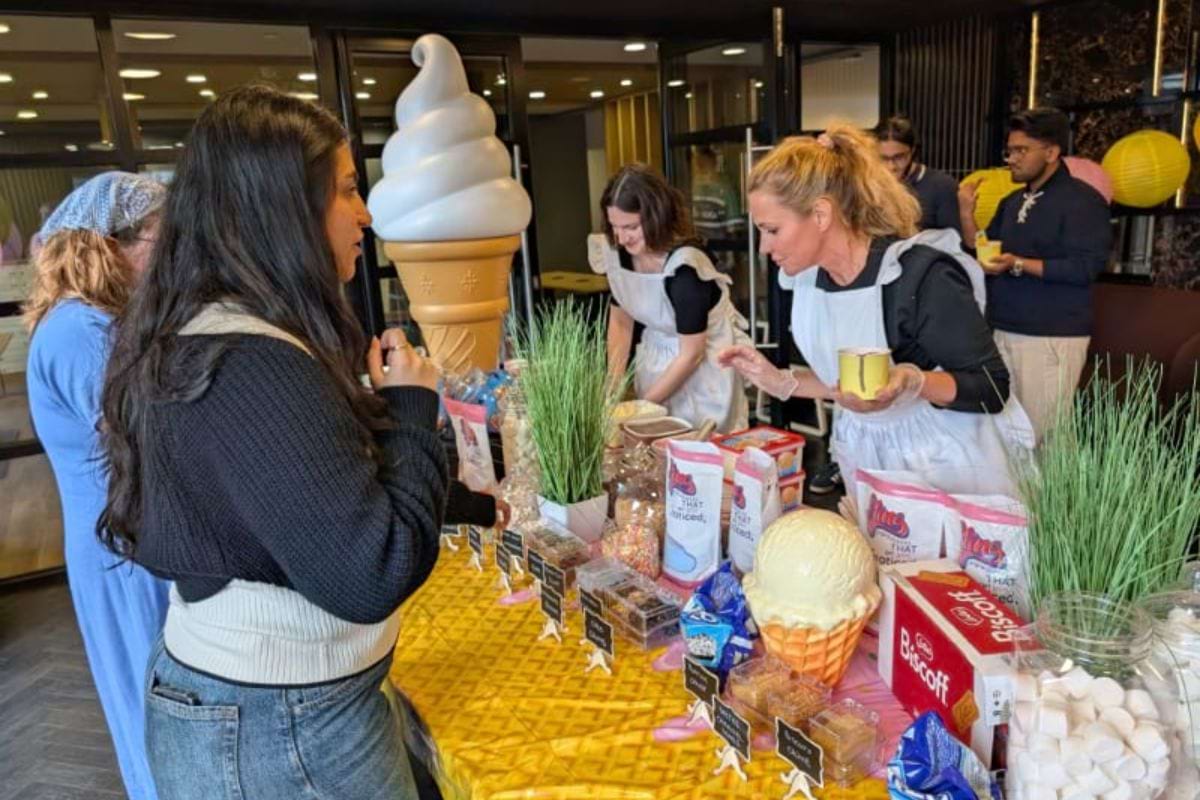Students trying to figure out what toppings to pic at the ice cream event at CODE student accommodation at fairfax street