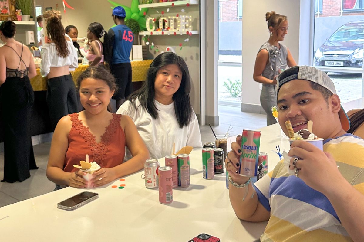 Students sitting together at a table inside