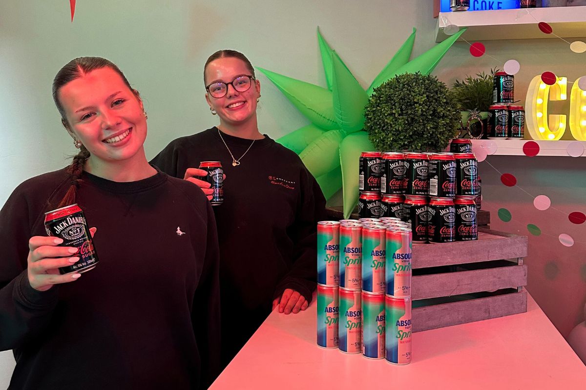 Student ambassadors serving drinks at the bar