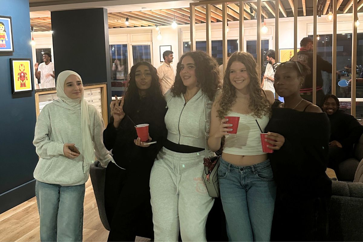 a group of friends smiling in front of the camera