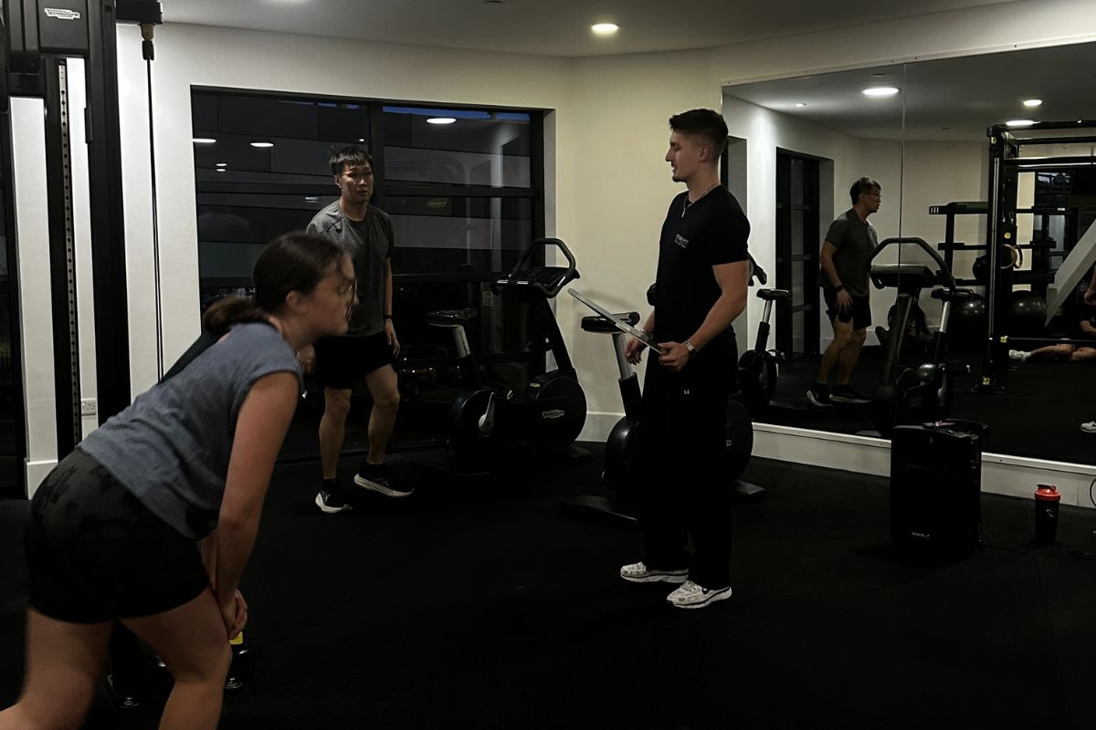 A Personal trainer joining us in the gym to instruct a fitness class