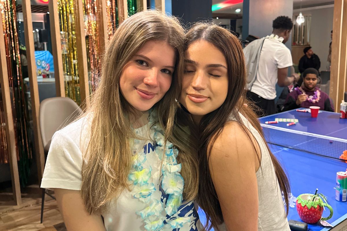 two friends posing in front of the camera