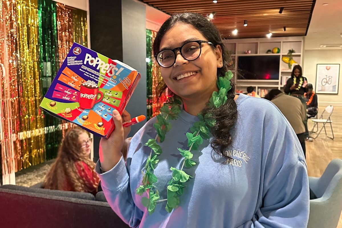 one of the lucky winners at bingo holding up their prize