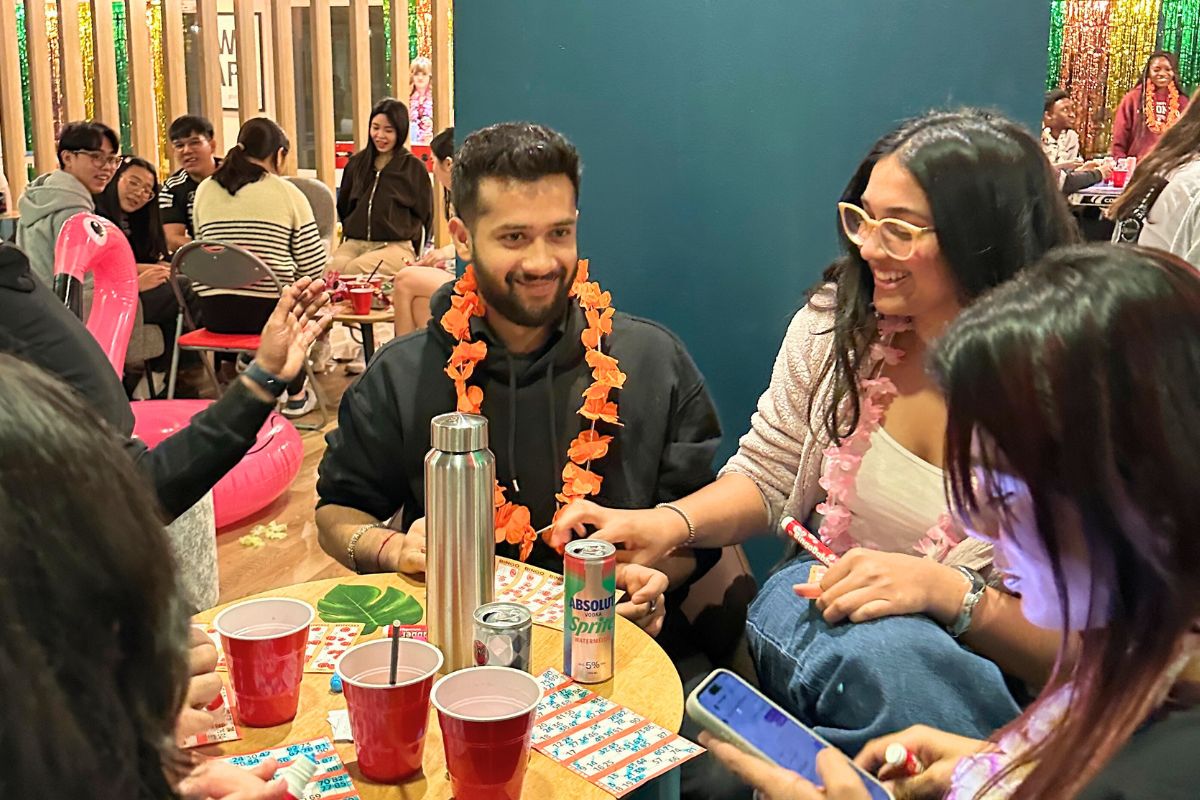a table full of students playing bingo