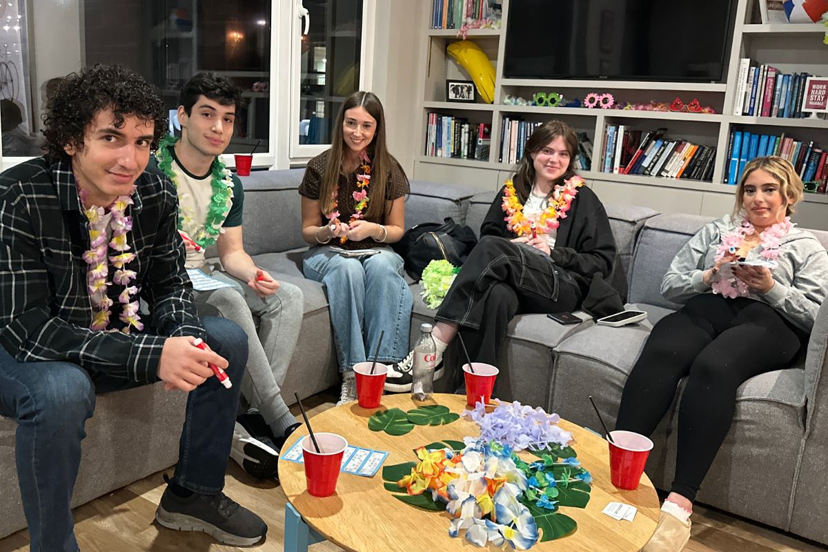 students in the communal sofa enjoying playing bingo
