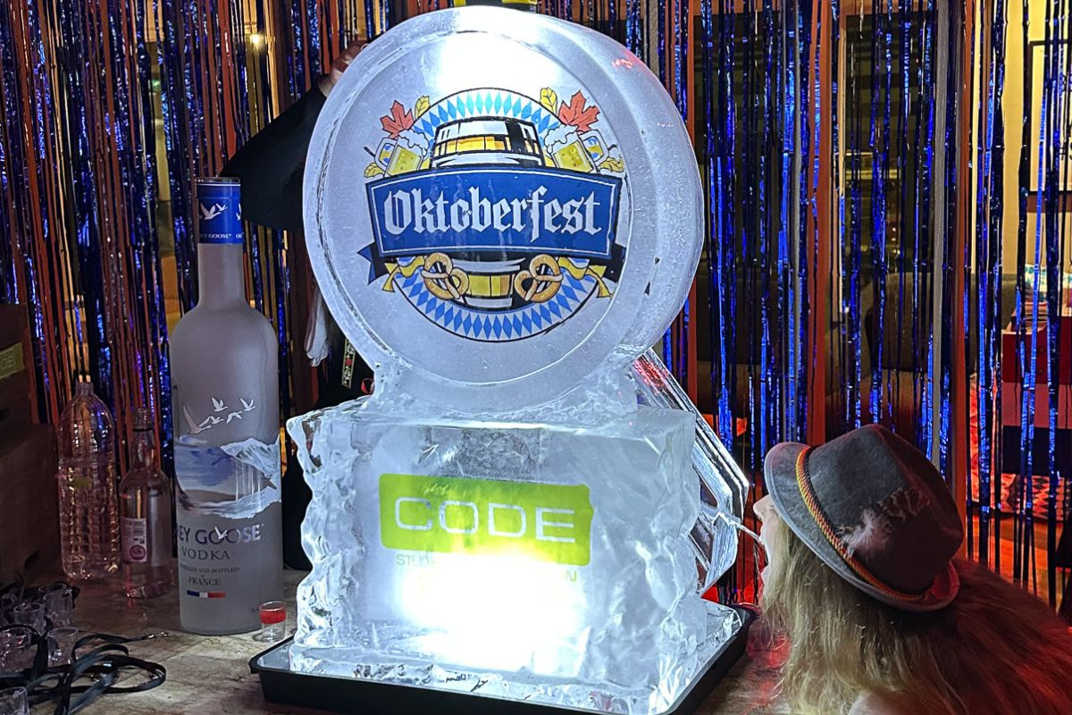 Student expertly drinking from an Oktoberfest ice sculpture