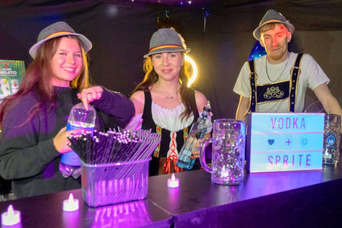 CODE staff serving drinks from behind the bar