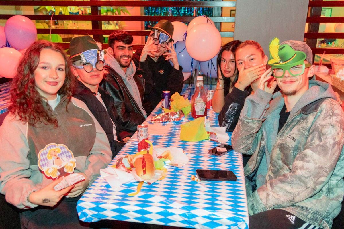 CODE student tenants enjoying hotdogs and drinks