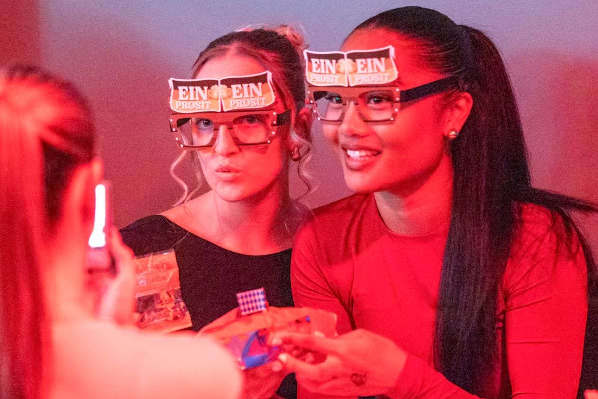 CODE student tenants wearing silly glasses at Oktoberfest