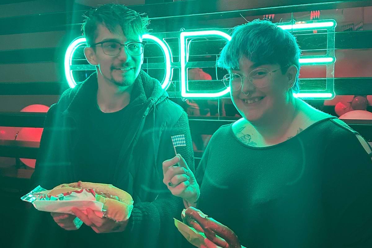 CODE student tenants enjoying their hotdogs