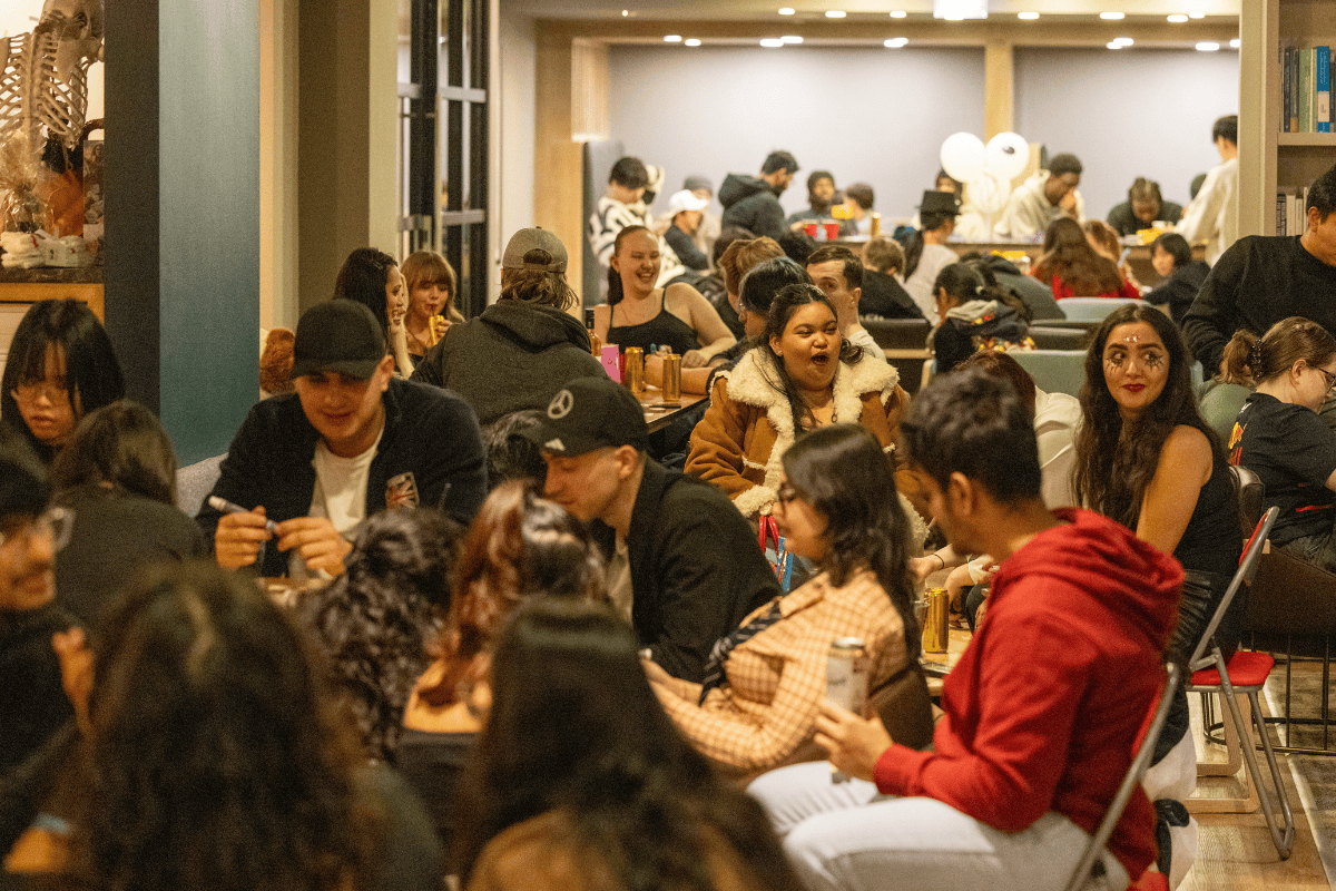 CODE communal area full with students ready to play BINGO