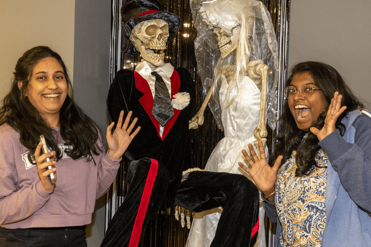 Students posing with decorations at the CODE Bingo
