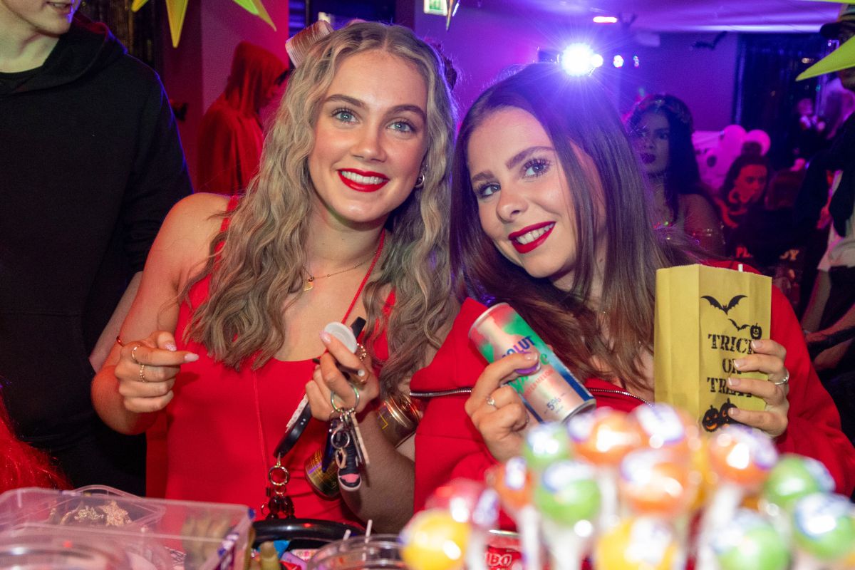 CODE students enjoying their drinks and sweets at the halloween bingo