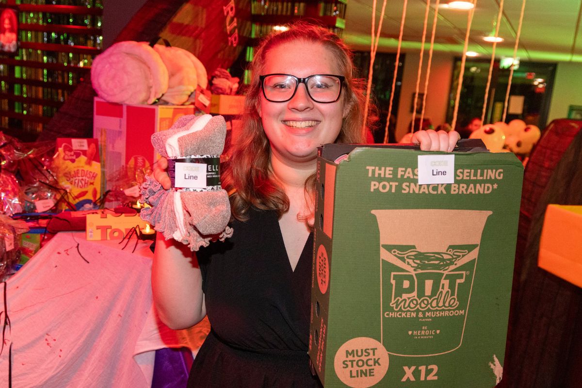 A CODE students holding up their prize