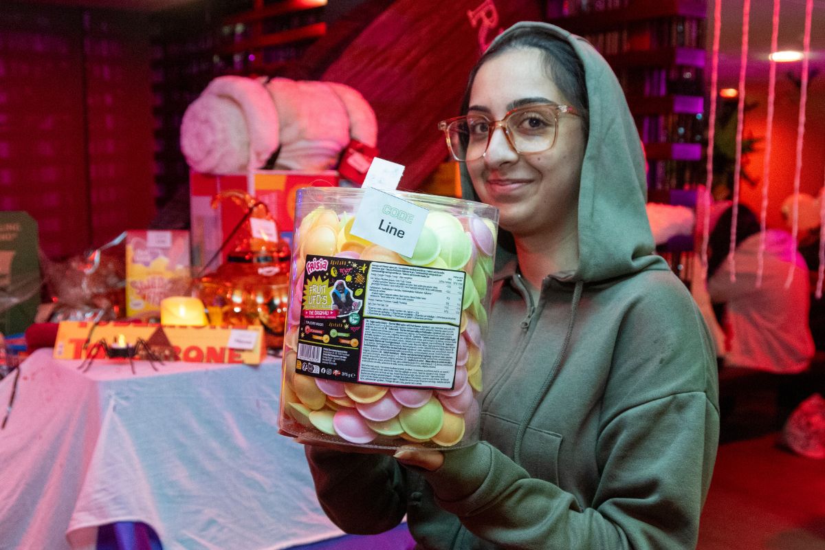 CODE tenant with their bingo prize