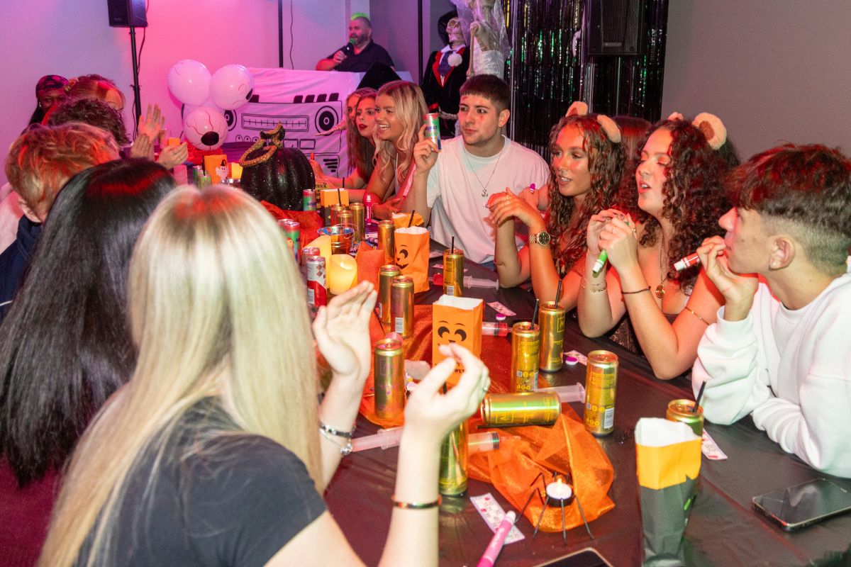 A table full of CODE students enjoying the halloween bingo
